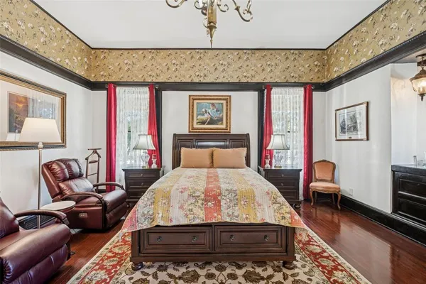 a bedroom with furniture and a tv