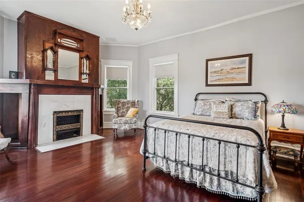a bedroom with a bed and a fireplace