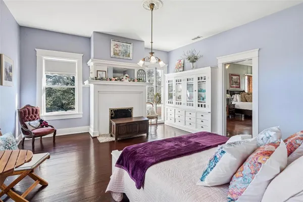 a bedroom with a bed and a couch