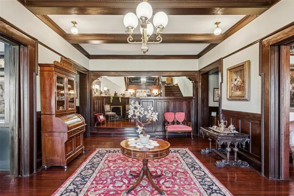 a living room with a couch and a chandelier