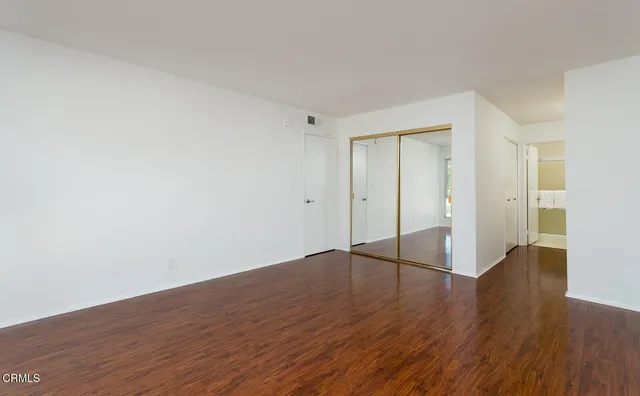 a bedroom with a bed and a table