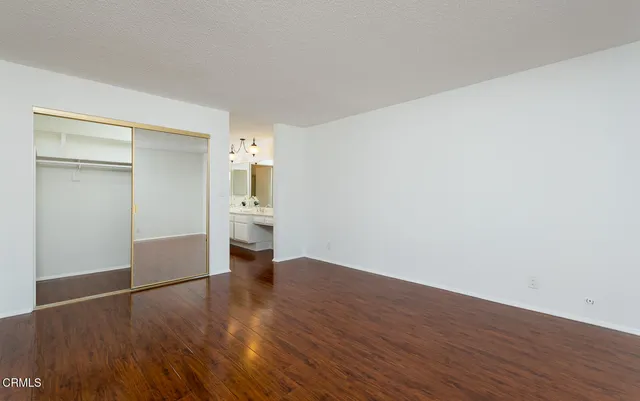 a view of cabinets with wooden floor