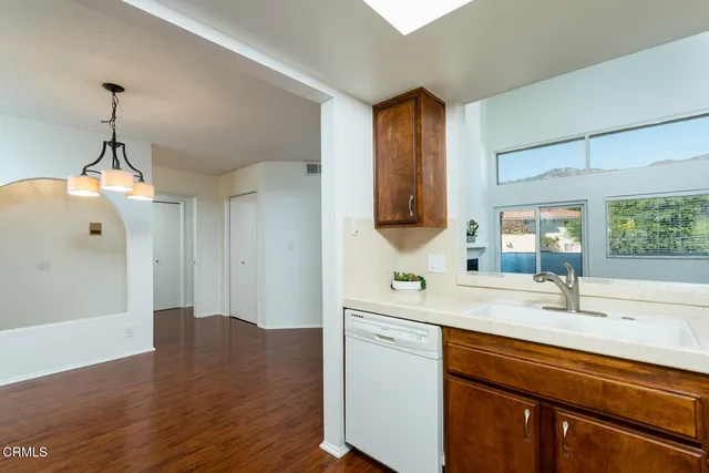 a view of a house with sitting area and garden