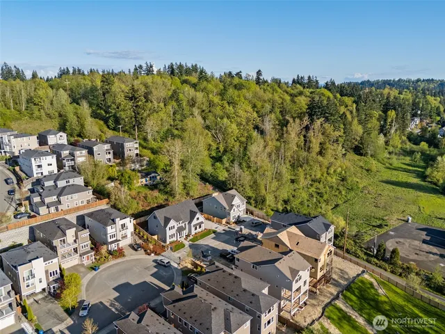an aerial view of a house with a yard lake view