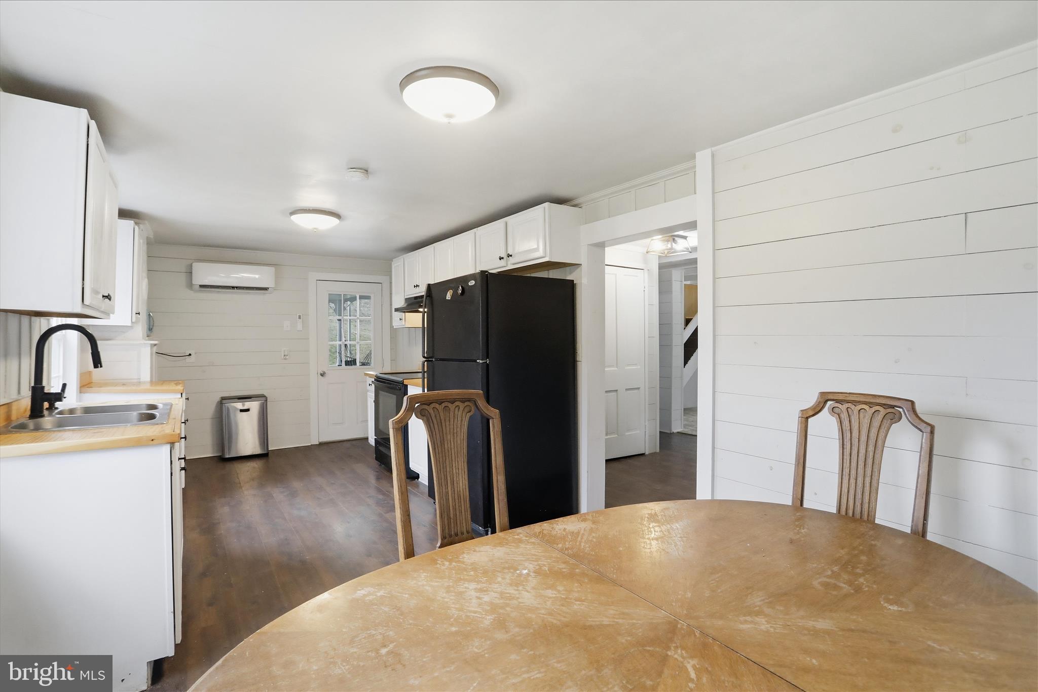 277 Bowmans Ridge Lane Burlington, WV 26710 - Photo 12 of 42 a view of a refrigerator in kitchen and entryway