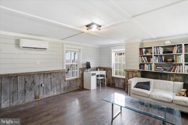 a kitchen that has a lot of cabinets and appliances