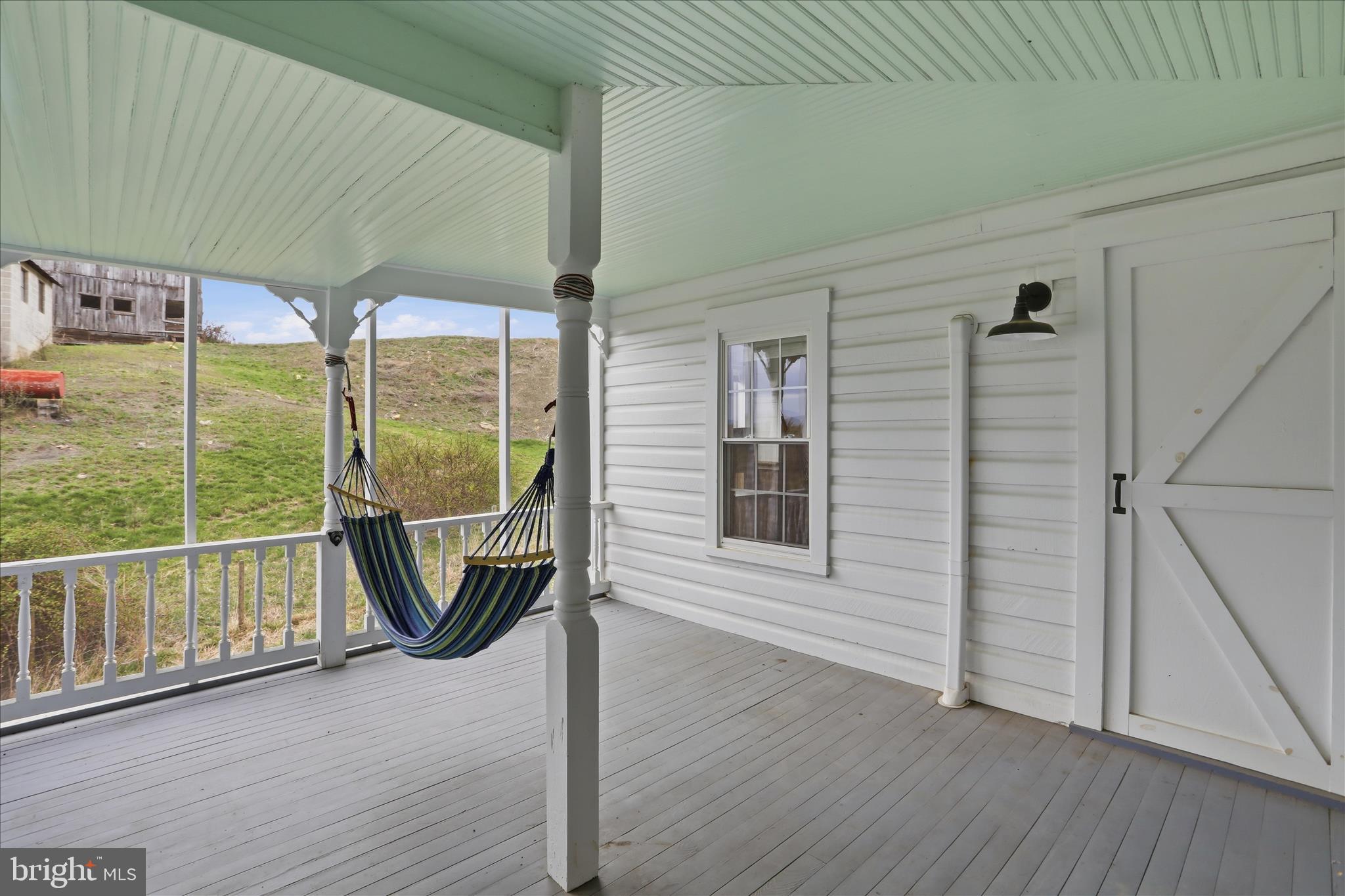 277 Bowmans Ridge Lane Burlington, WV 26710 - Photo 18 of 42 an empty room with wooden floor and windows