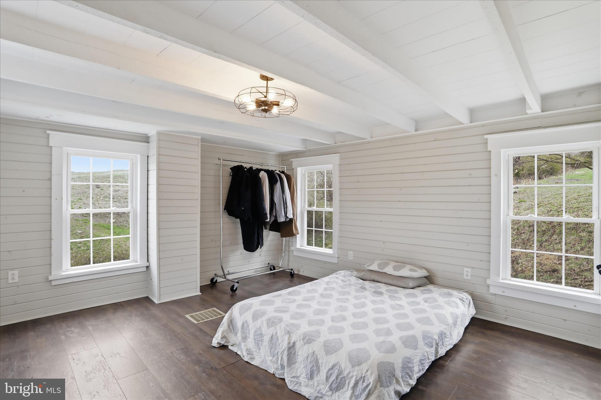 277 Bowmans Ridge Lane Burlington, WV 26710 - Photo 22 of 42 a bedroom with a bed and wooden floor