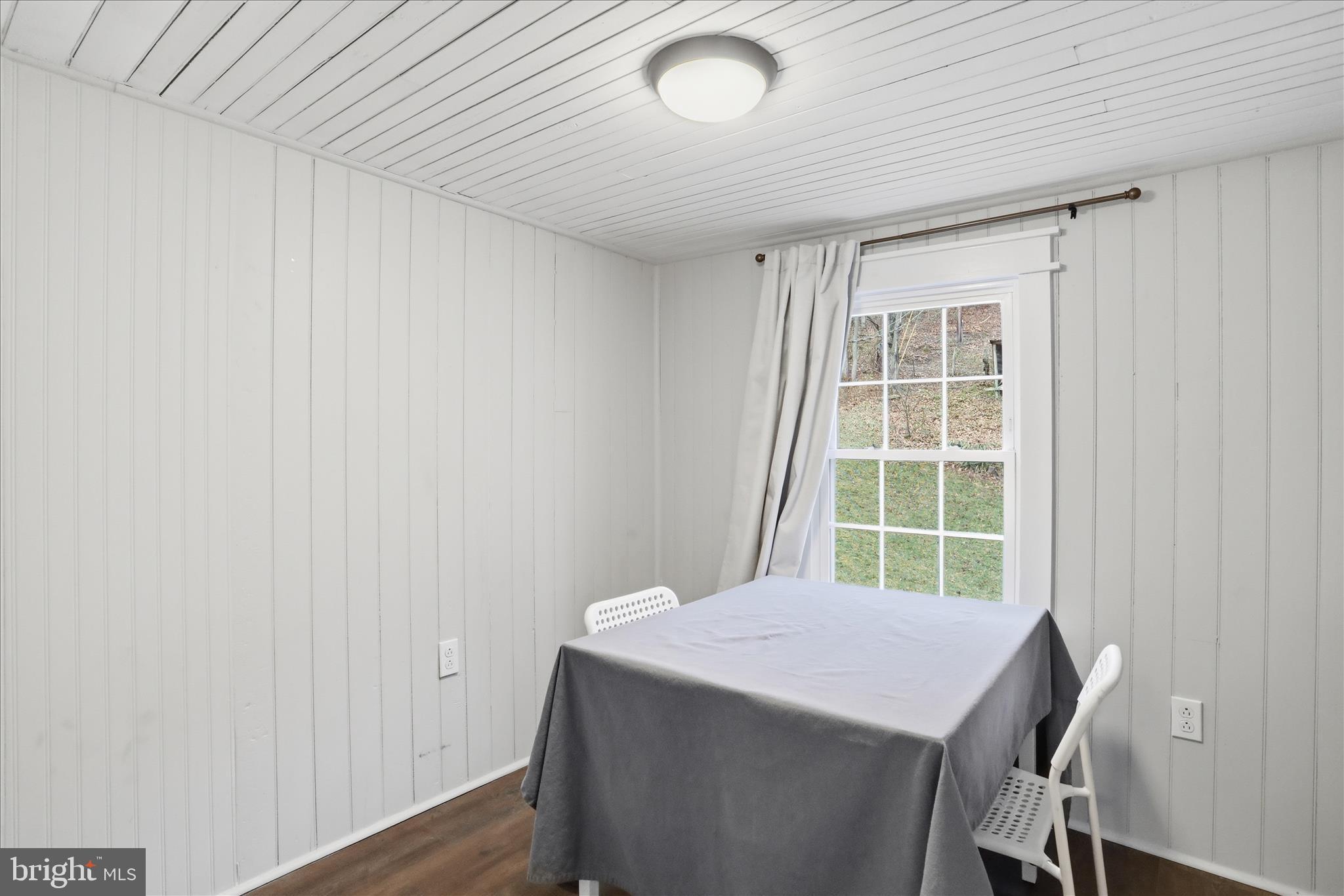 277 Bowmans Ridge Lane Burlington, WV 26710 - Photo 25 of 42 a view of a room with wooden floor and windows