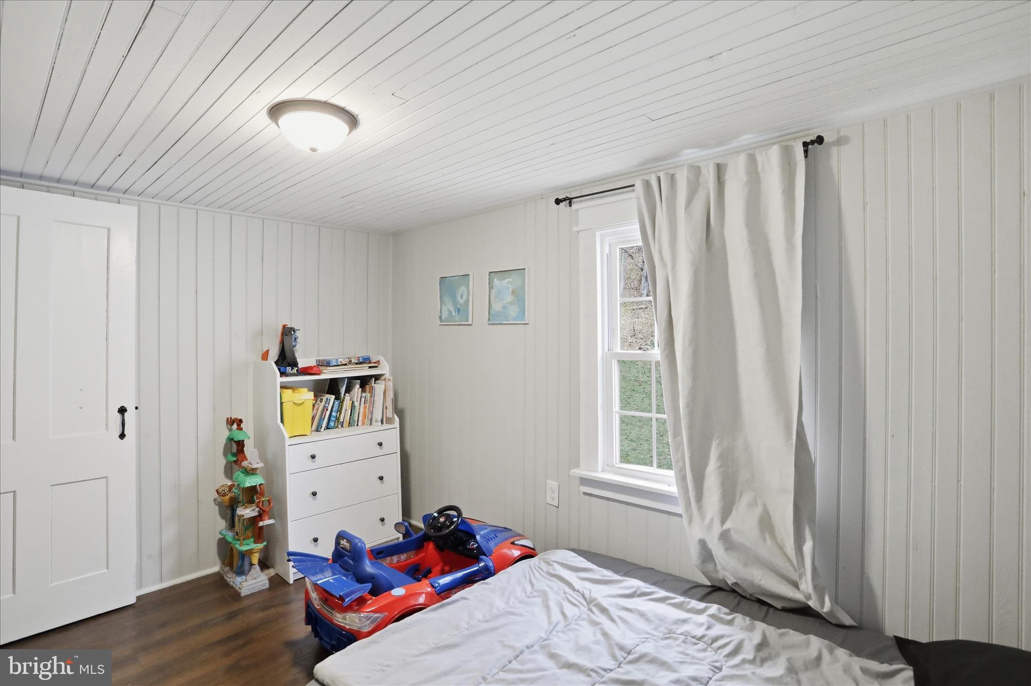 277 Bowmans Ridge Lane Burlington, WV 26710 - Photo 28 of 42 a bed room with a bed and a window