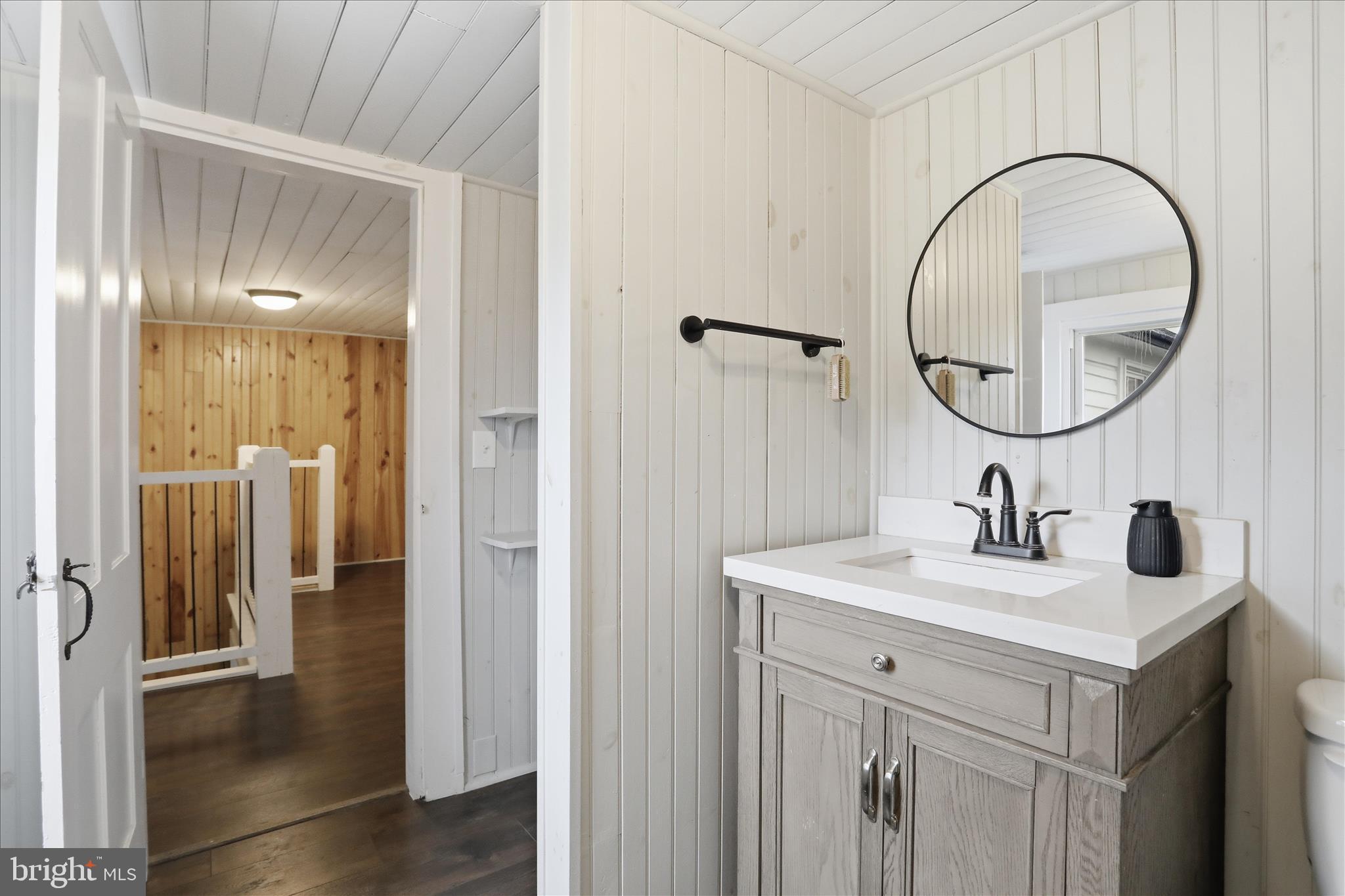 277 Bowmans Ridge Lane Burlington, WV 26710 - Photo 29 of 42 a bathroom with a sink and a mirror