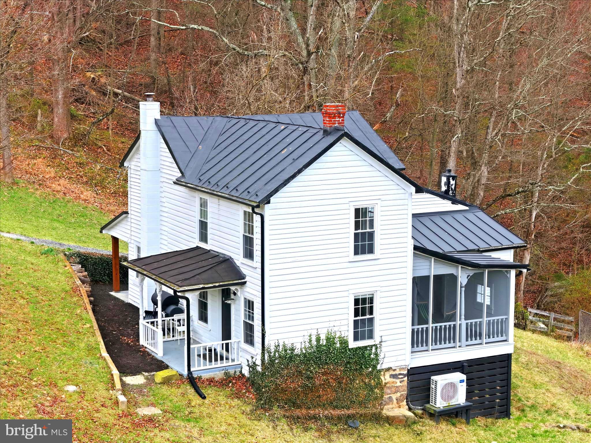 277 Bowmans Ridge Lane Burlington, WV 26710 - Photo 3 of 42 a front view of a house with a yard
