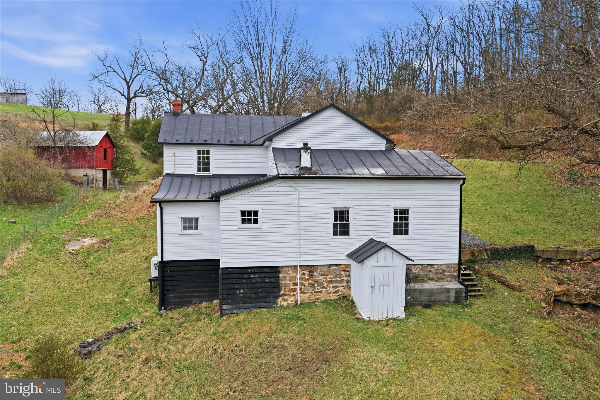 277 Bowmans Ridge Lane Burlington, WV 26710 - Photo 40 of 42 a view of a house with backyard