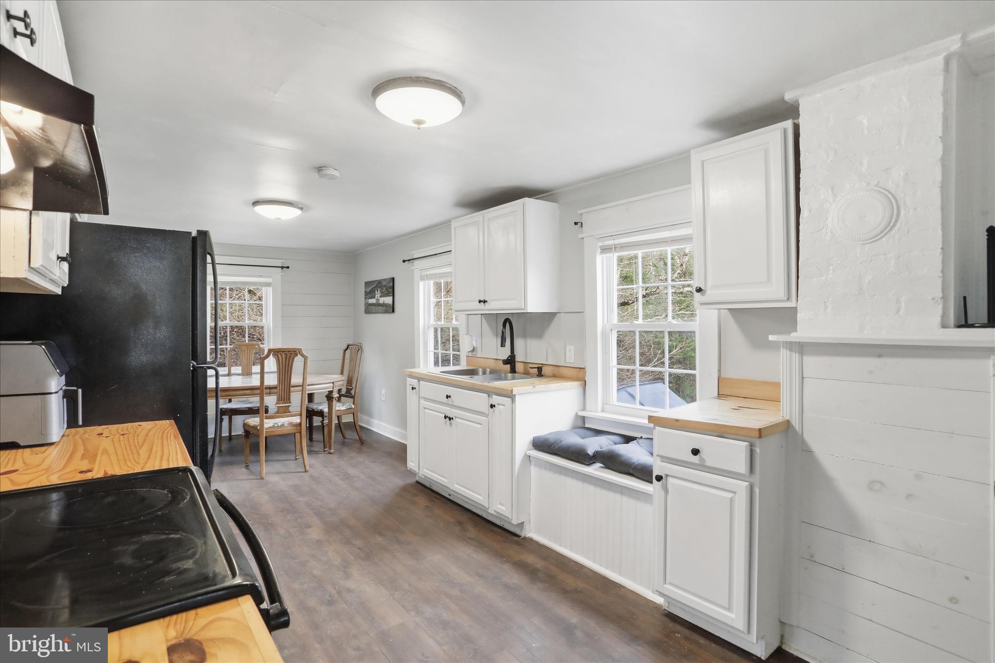 277 Bowmans Ridge Lane Burlington, WV 26710 - Photo 9 of 42 a kitchen with stainless steel appliances granite countertop a refrigerator stove microwave and sink