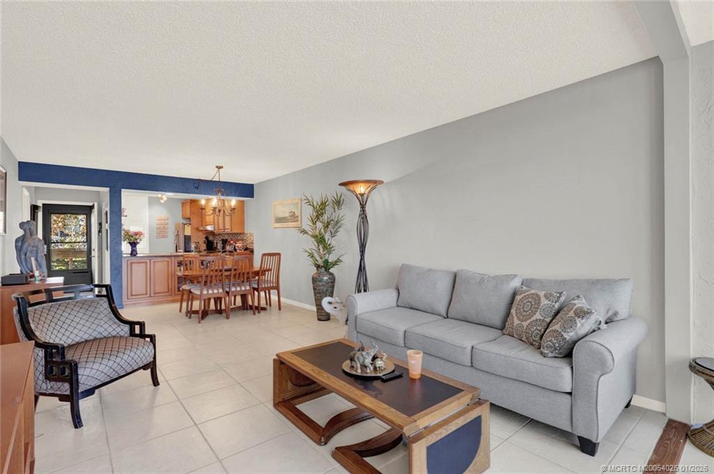 1950 Southwest Palm City Road, Unit 8106 Stuart, FL 34994 - Photo 23 of 54 a living room with furniture and a couch