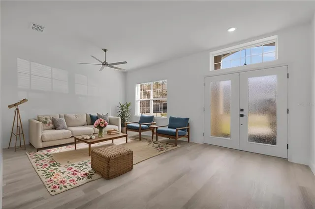 a living room with furniture and a window