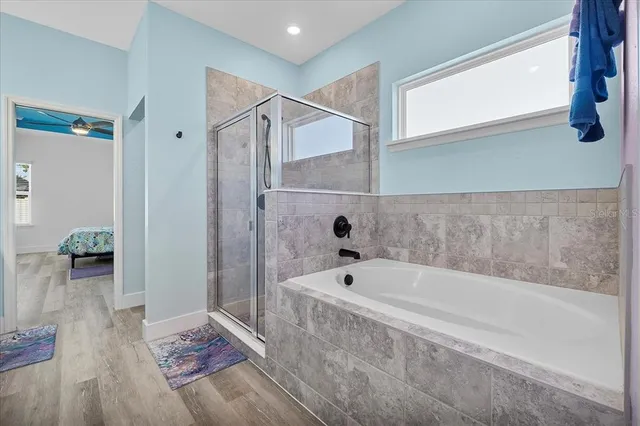 a bathroom with a tub and shower