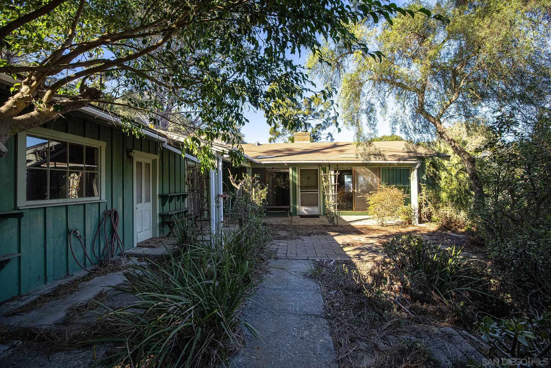 1260 Oribia Road Del Mar, CA 92014 - Photo 3 of 24 a front view of a house with garden
