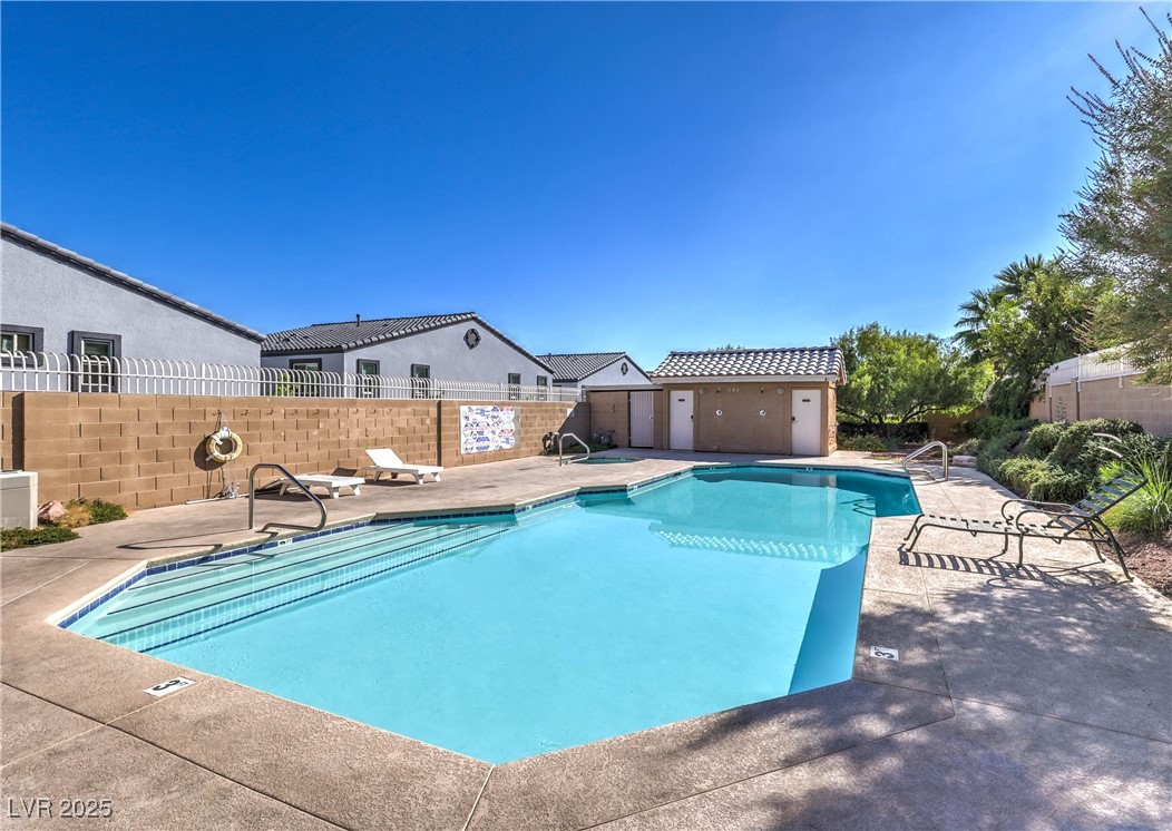8056 Cimarron Ridge Drive, Unit 101 Las Vegas, NV 89128 - Photo 31 of 31 Community pool with a patio area