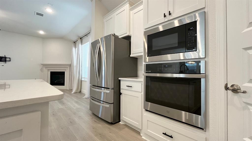 5304 Babcock Road McKinney, TX 75071 - Photo 4 of 27 a kitchen with a refrigerator an oven