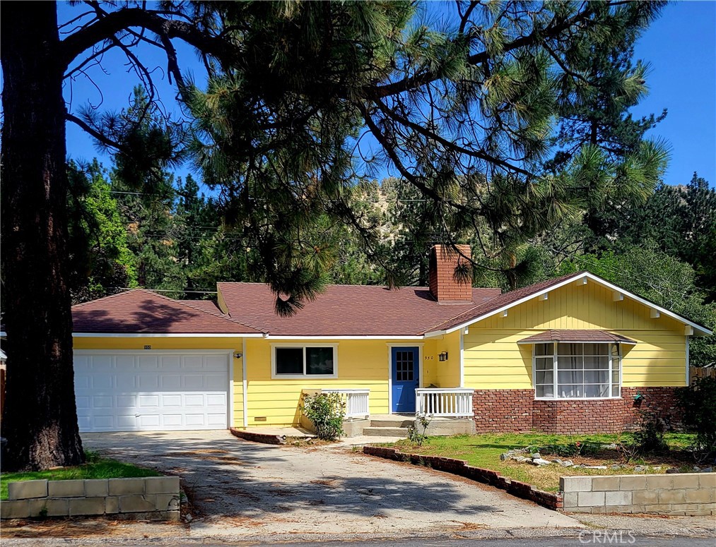 950 Evergreen Road Wrightwood, CA 92397 - Photo 1 of 1 a front view of a house with a yard