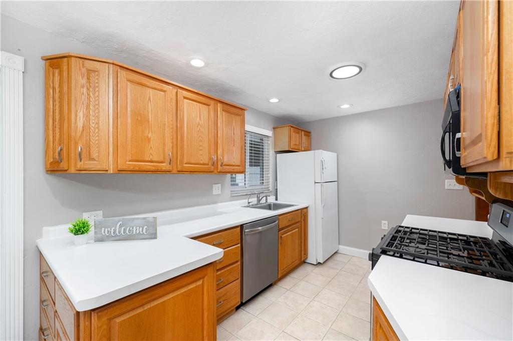 350 Limerick Road Wexford, PA 15090 - Photo 12 of 47 a kitchen with a sink a stove and cabinets