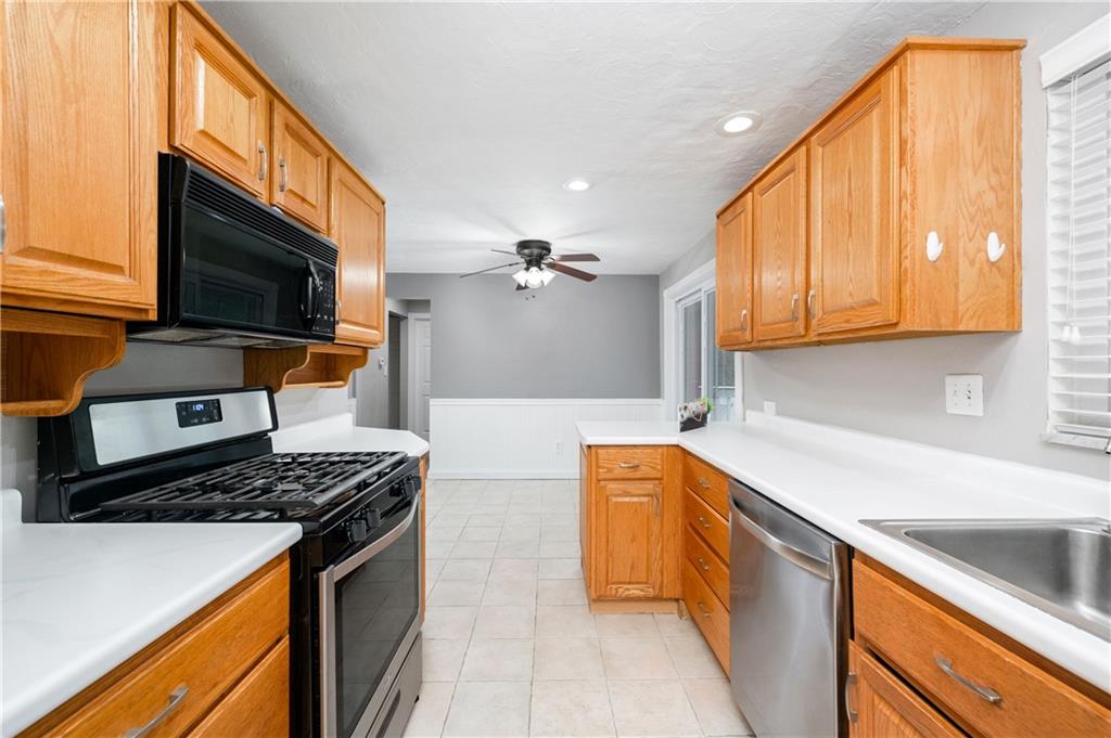 350 Limerick Road Wexford, PA 15090 - Photo 13 of 47 a kitchen with stainless steel appliances a stove a sink and a microwave