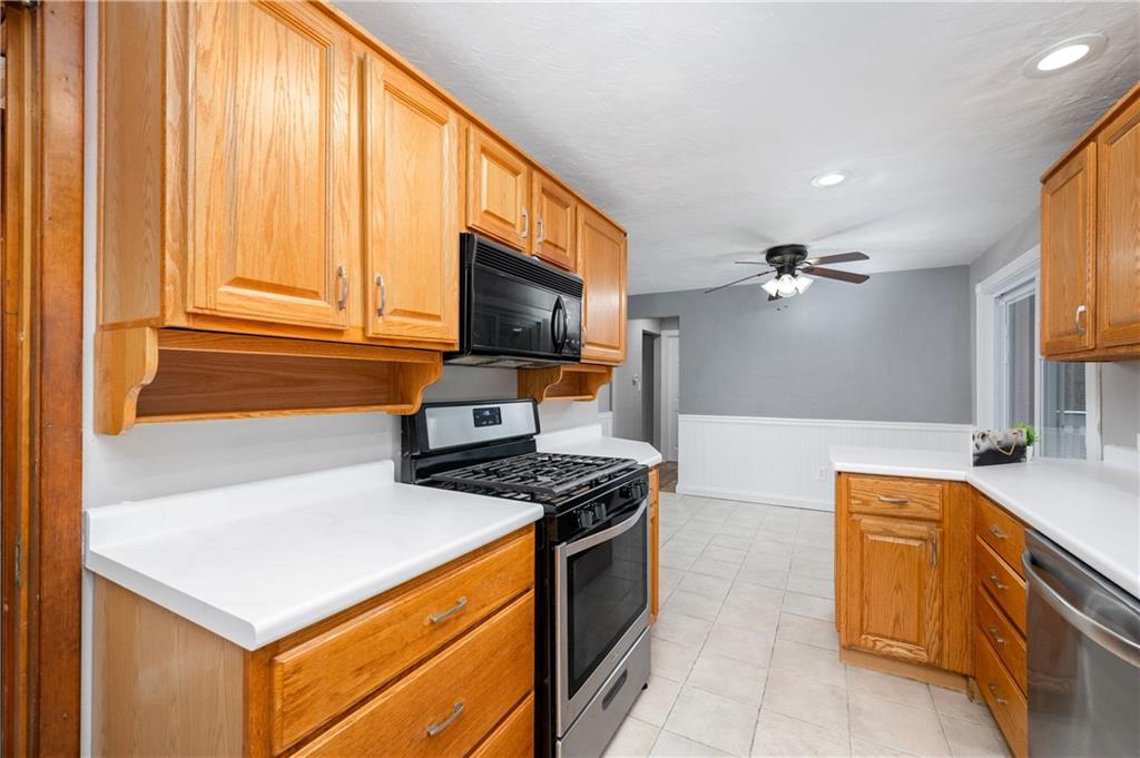 350 Limerick Road Wexford, PA 15090 - Photo 14 of 47 a kitchen with stainless steel appliances granite countertop a stove a sink and a microwave