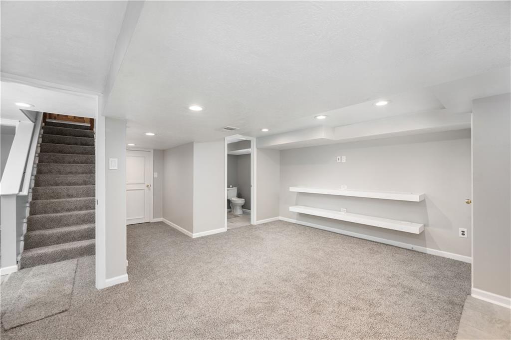 350 Limerick Road Wexford, PA 15090 - Photo 30 of 47 an empty room with a stairs and way to couch