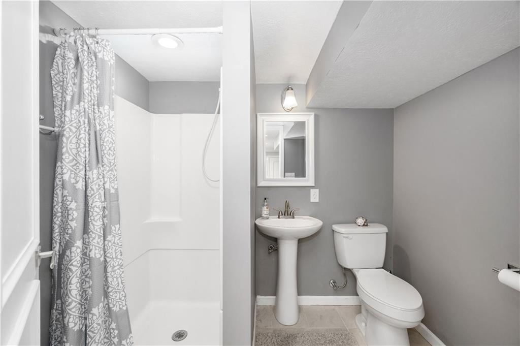 350 Limerick Road Wexford, PA 15090 - Photo 32 of 47 a bathroom with a toilet sink and shower