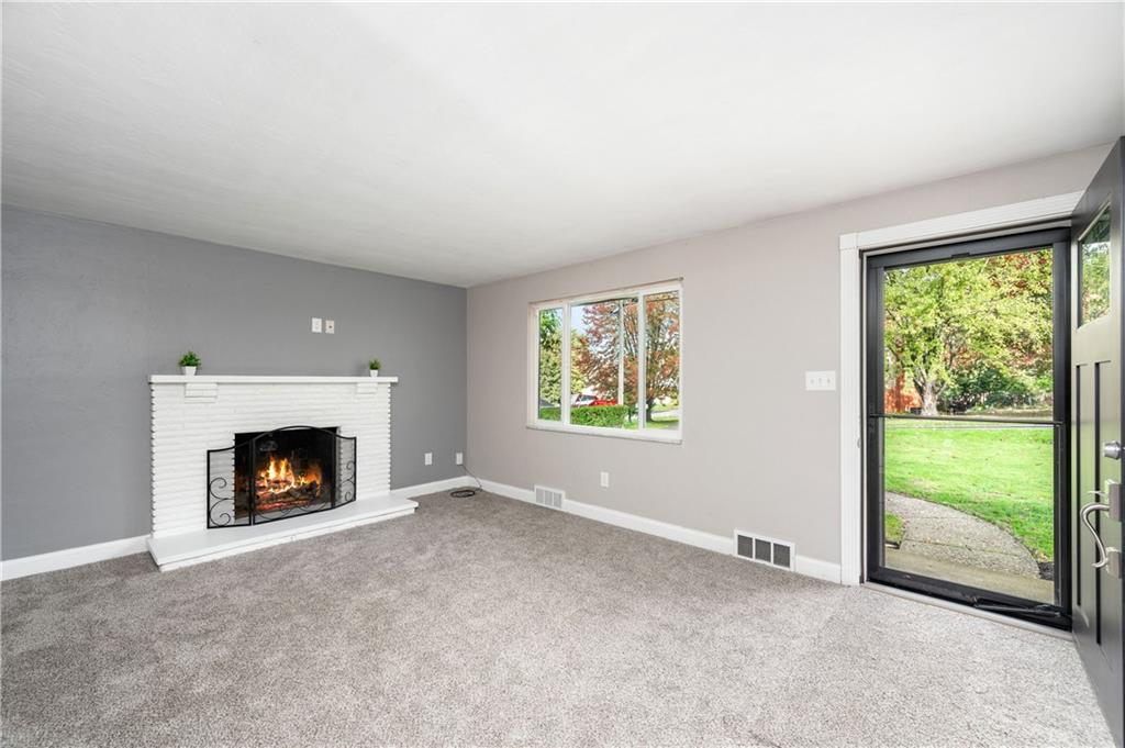 350 Limerick Road Wexford, PA 15090 - Photo 6 of 47 a view of an empty room with a fireplace and a window