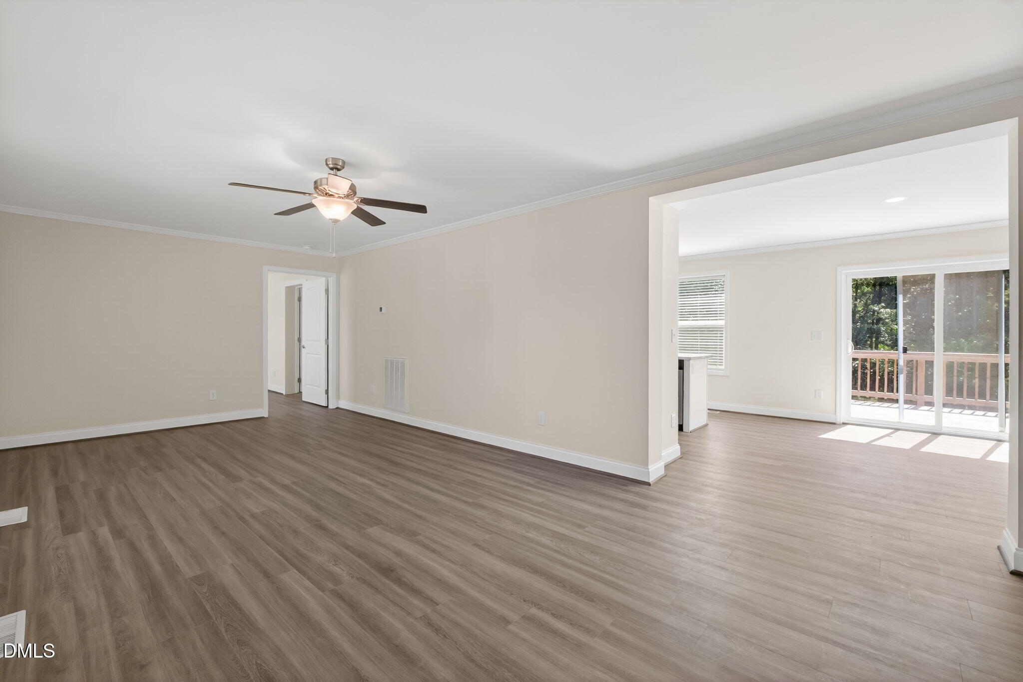 7122 Guess Road Hillsborough, NC 27278 - Photo 24 of 48 a view of an empty room with wooden floor and a window