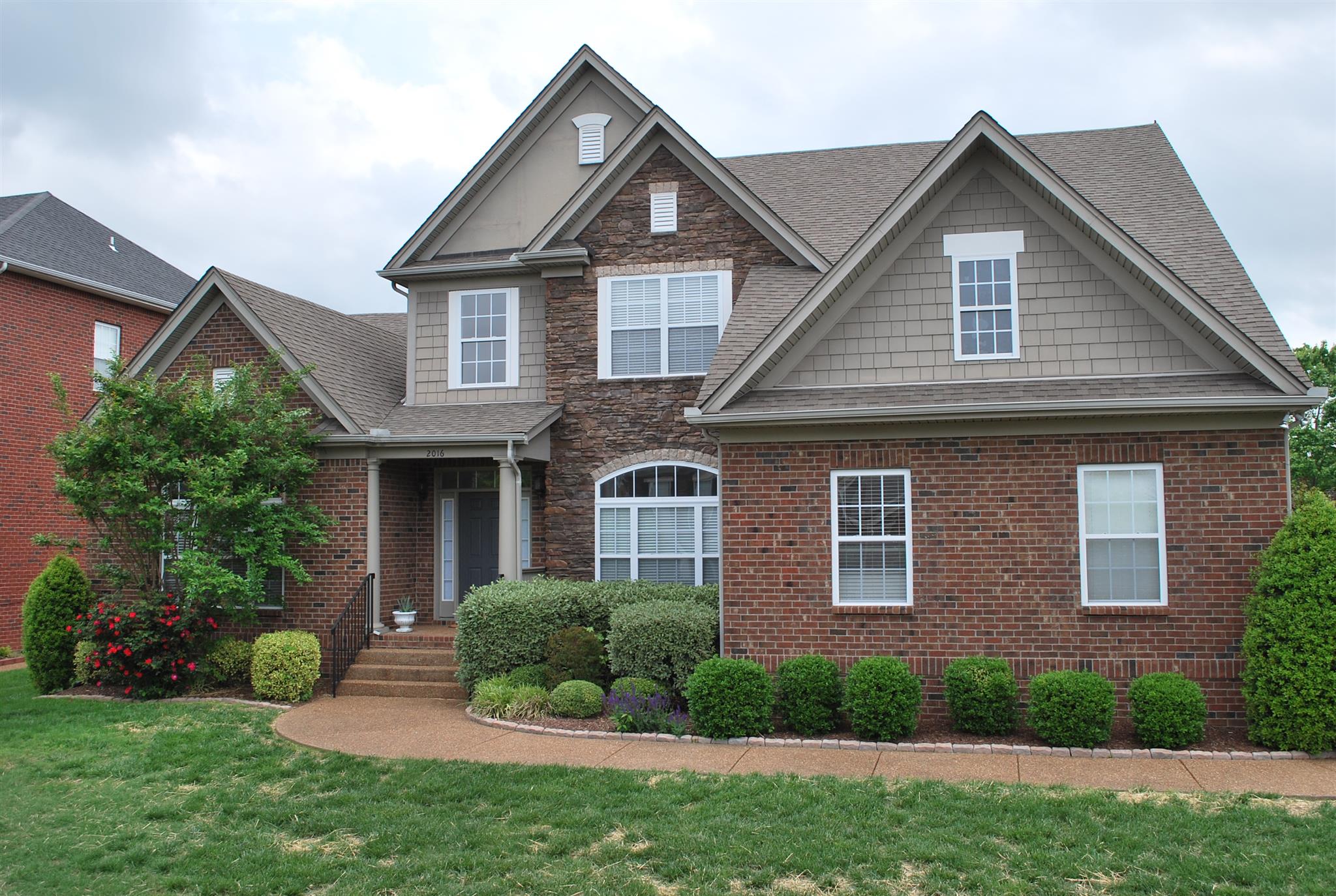 2016 Brewster Drive Franklin, TN 37067 - Photo 1 of 30 a front view of a house with a yard
