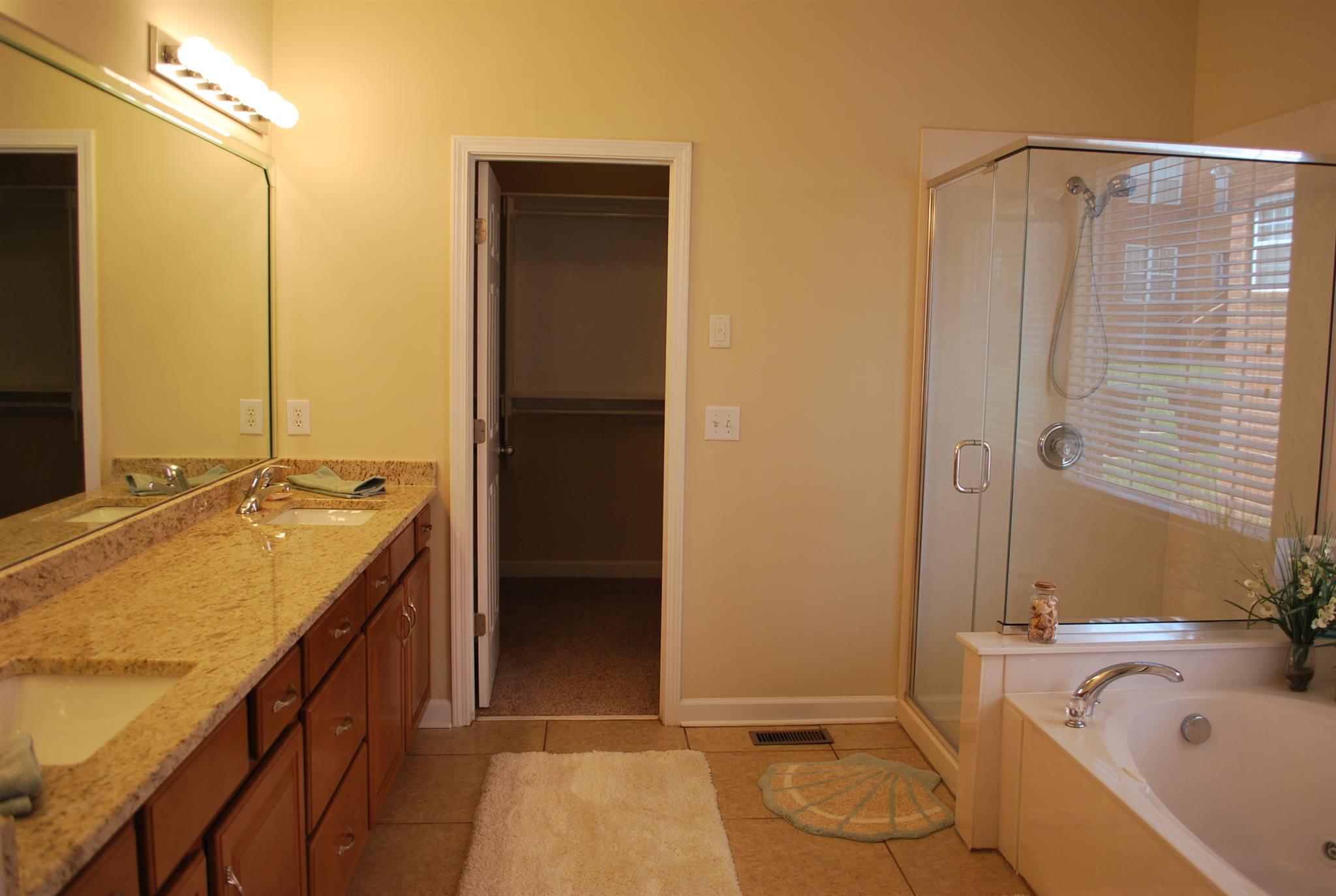 2016 Brewster Drive Franklin, TN 37067 - Photo 13 of 30 a bathroom with a tub sink and mirror
