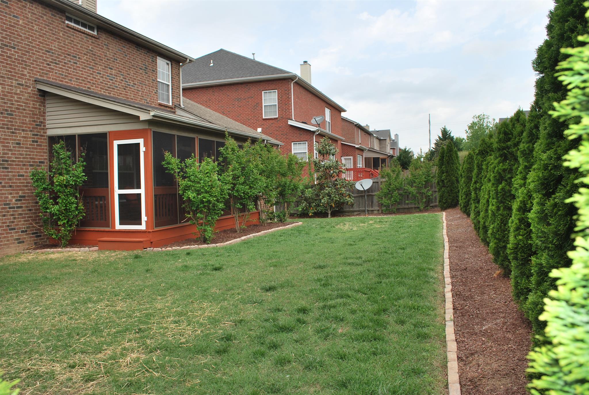 2016 Brewster Drive Franklin, TN 37067 - Photo 28 of 30 a front view of a house with a yard and trees