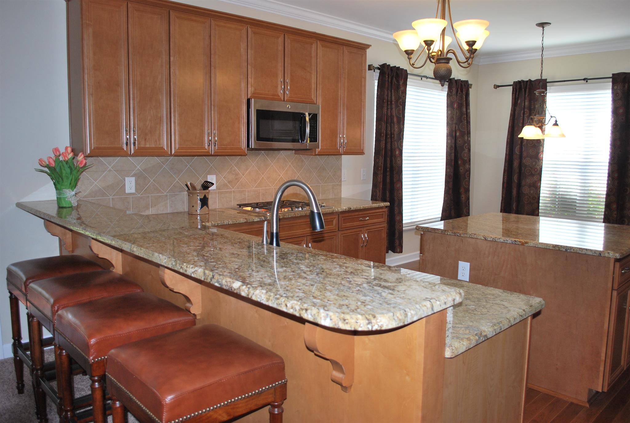 2016 Brewster Drive Franklin, TN 37067 - Photo 5 of 30 a kitchen with stainless steel appliances granite countertop a sink refrigerator and microwave