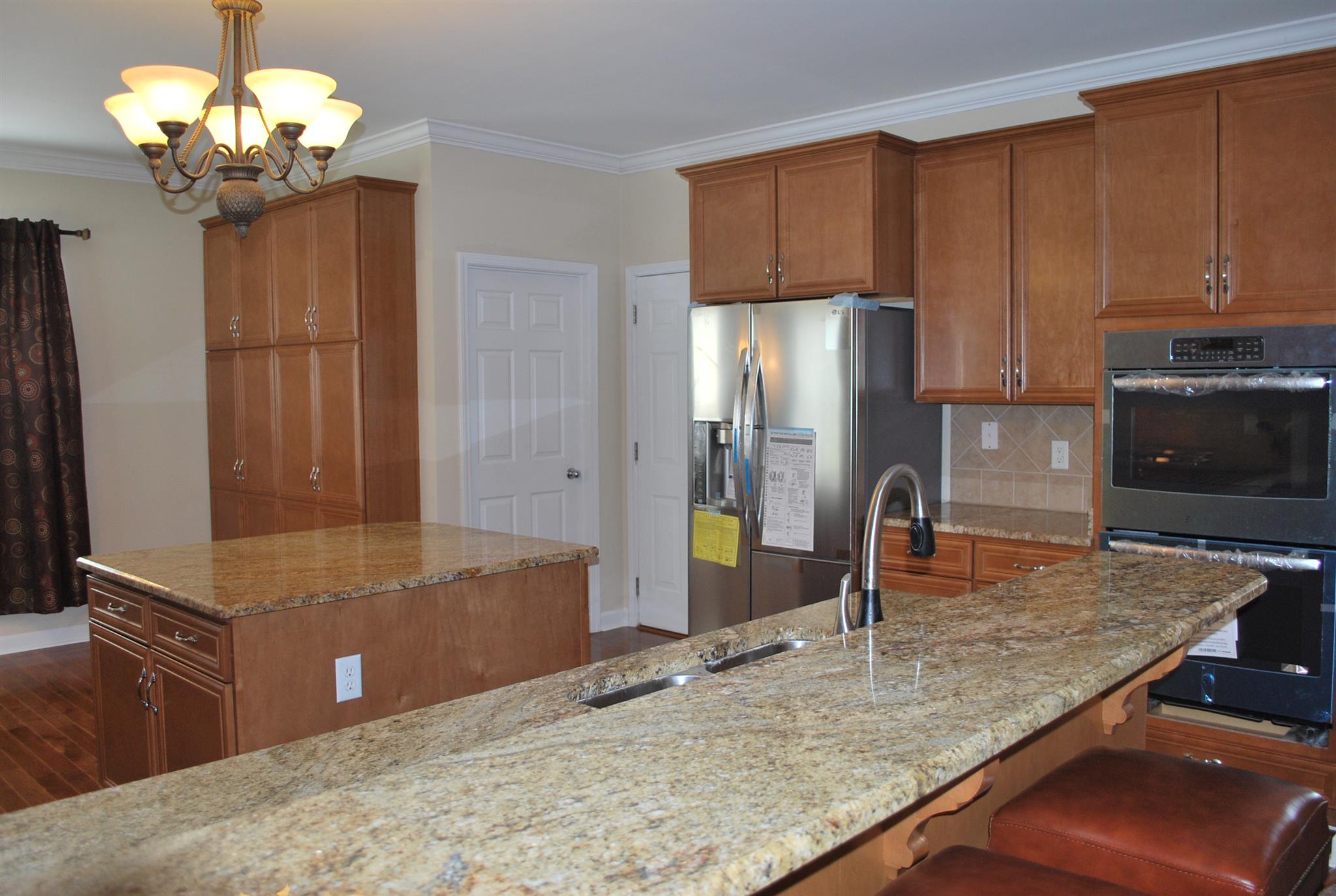 2016 Brewster Drive Franklin, TN 37067 - Photo 6 of 30 a kitchen with stainless steel appliances granite countertop a sink refrigerator and cabinets