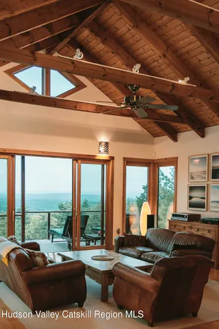 a view of a chairs and table on the balcony
