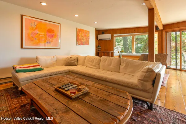 a living room with furniture and a large window