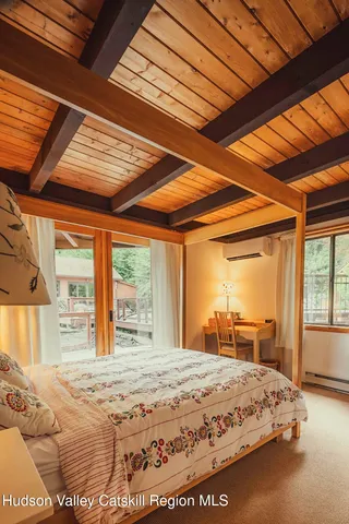 a room with pool table and windows