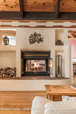 a view of fireplace and living room