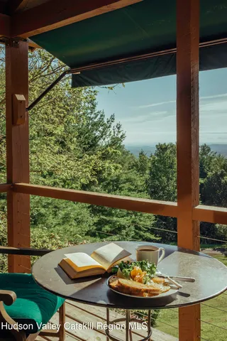 a view of a balcony with chair and table