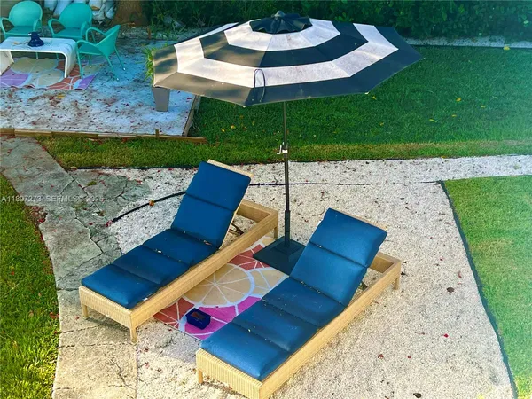 a view of a fountain in front of a house