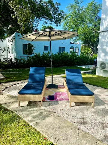 a bedroom with a bed couch and dresser