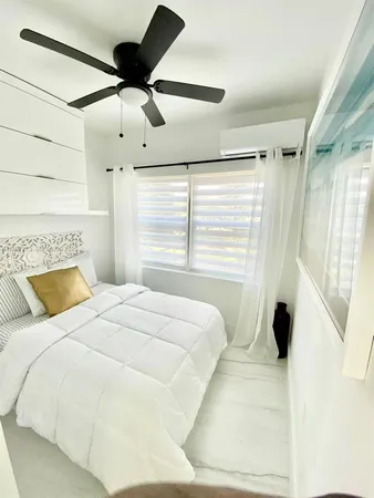 a bathroom with a toilet a sink and shower