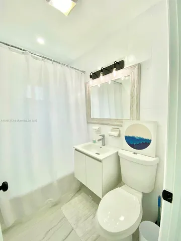 a kitchen with stainless steel appliances a sink and cabinets