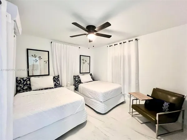 a bedroom with a bed and a walk in closet