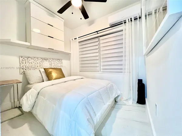 a bedroom with a bed and furniture