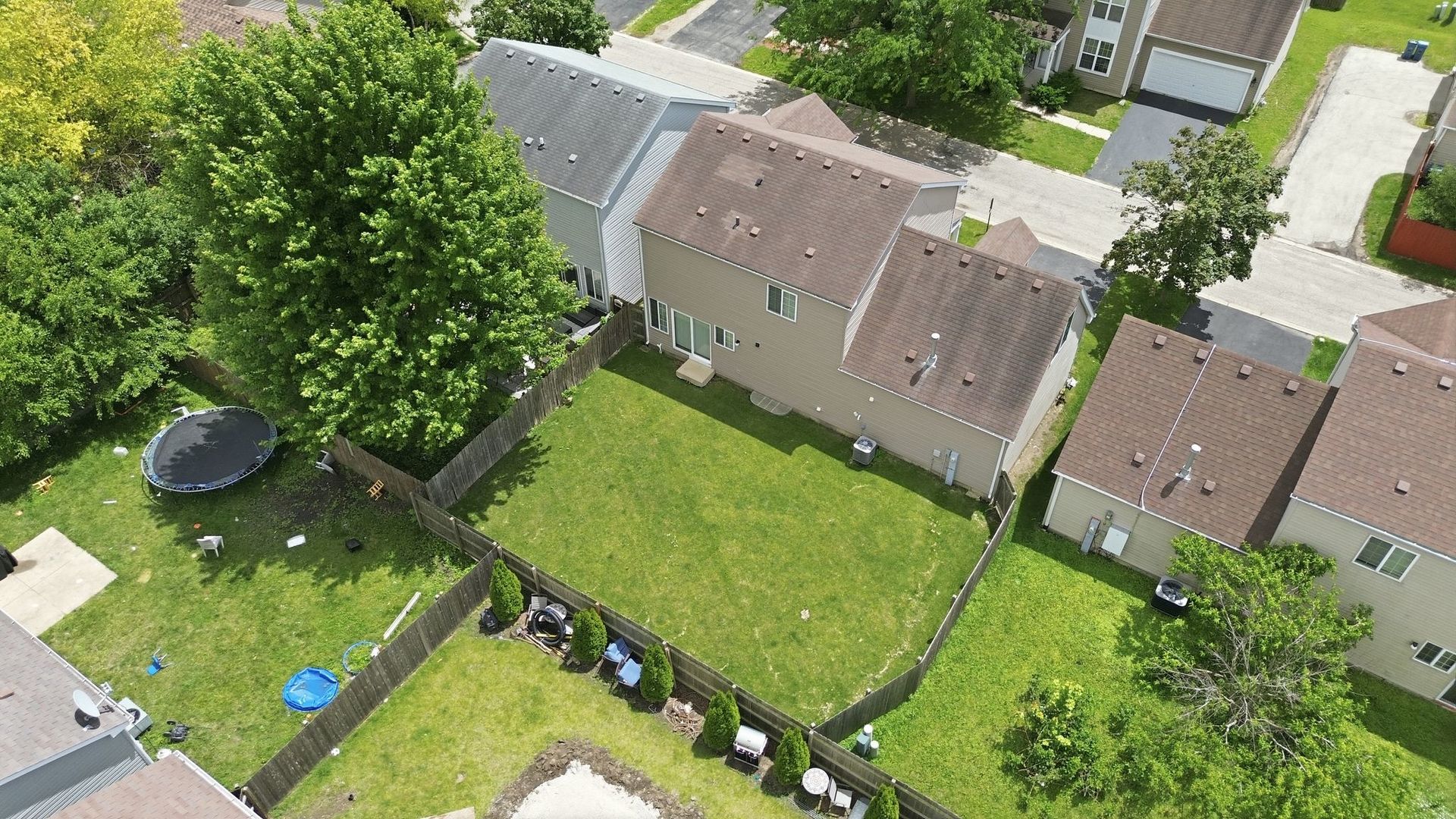 1758 Edith Lane Aurora, IL 60504 - Photo 26 of 28 an aerial view of a residential houses with outdoor space and street view