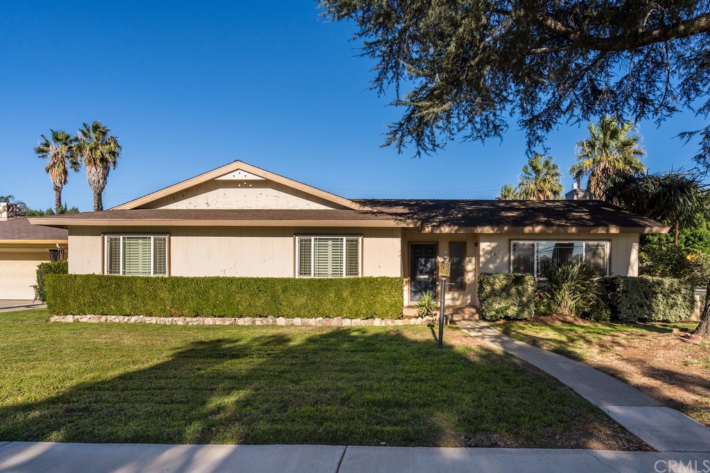 4913 Milford Road Riverside, CA 92504 - Photo 1 of 1 a front view of a house with a garden